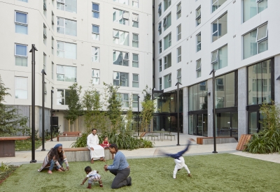 Families playing in the Courtyard of 222 Taylor Street, affordable housing in San Francisco