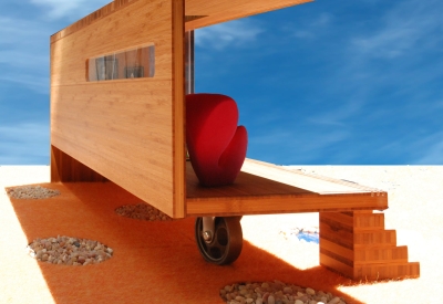 View of the underneath of Modularean Eco House, with its wheel making it mobile.