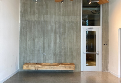 Custom sculpture and bench by DBA Workshop inside Coliseum Place, affordable housing in Oakland, Ca