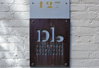 DBA Copper water-jet-cut sign outside of the David Baker Architects Office in San Francisco.