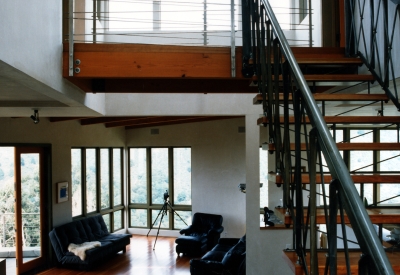 Interior view of the living room and custom stairs at Kayo House in Oakland, California.