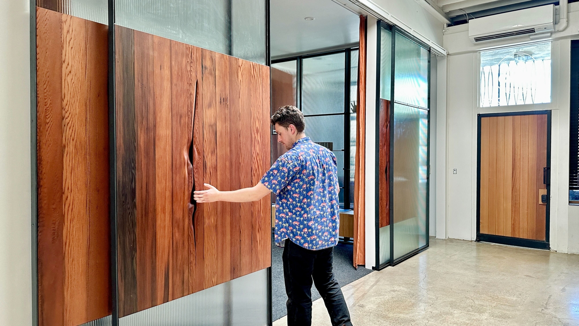 DBA_OAK sliding doors separating the conference room.