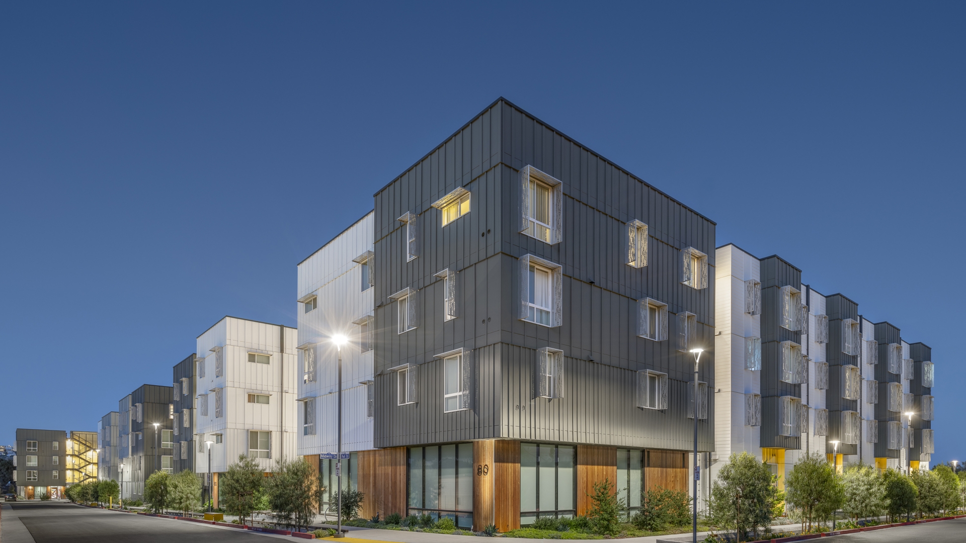 Exterior street view at dusk of 88 Park Street at Midway Village.