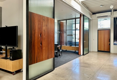 DBA_OAK sliding doors separating the conference room.