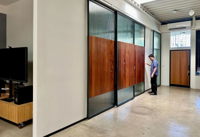 DBA_OAK sliding doors separating the conference room.