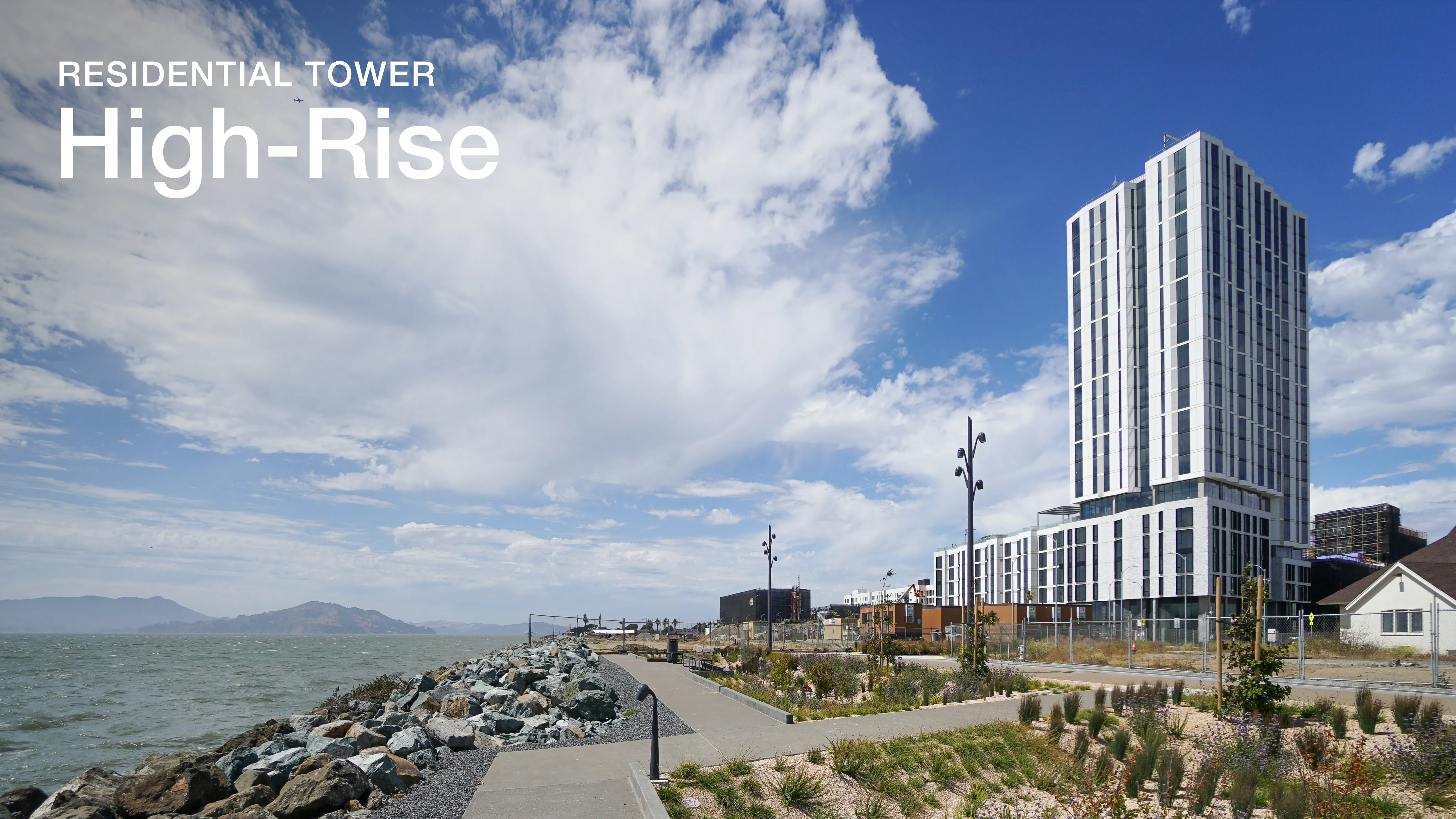 Exterior view of a high-rise building on Treasure Island with a view of the San Francisco Bay