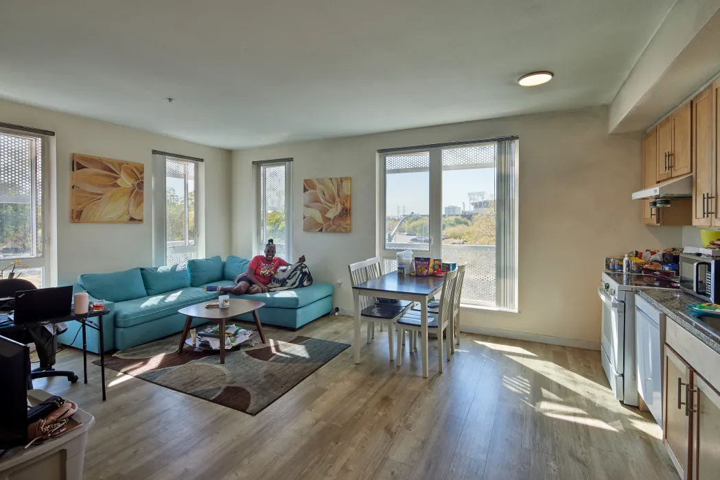 Unit living room inside Coliseum Place in Oakland, California.