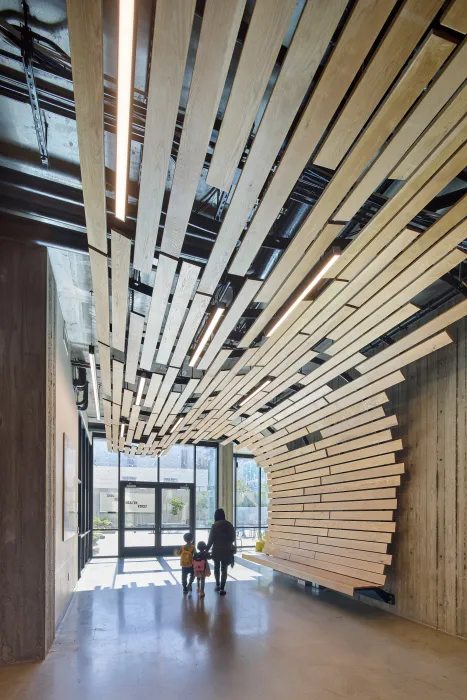 Custom wood ceiling and bench at 555 Larkin in San Francisco.