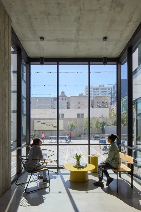 Community lounge area looking out to the courtyard at 555 Larkin in San Francisco.