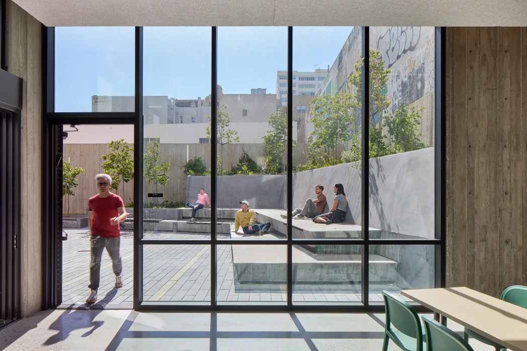 Floor to ceiling windows in the lounge looking out to the courtyard at 555 Larkin in San Francsico.