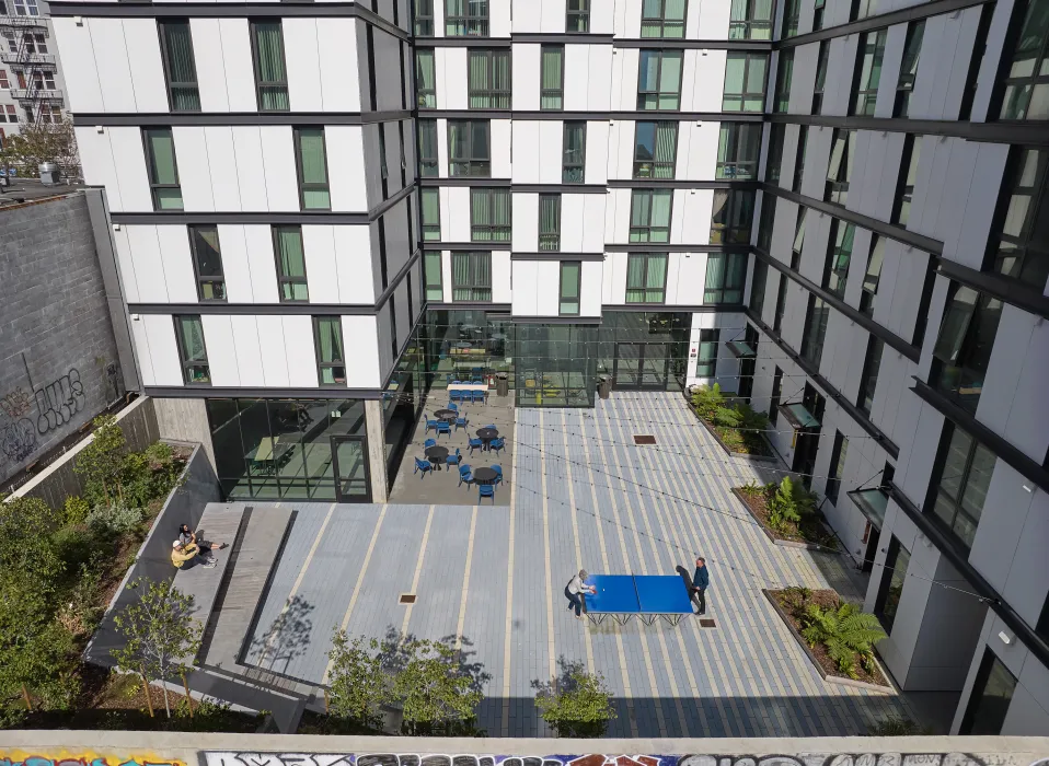 Birds eye view of the courtyard at 555 Larkin at dusk.