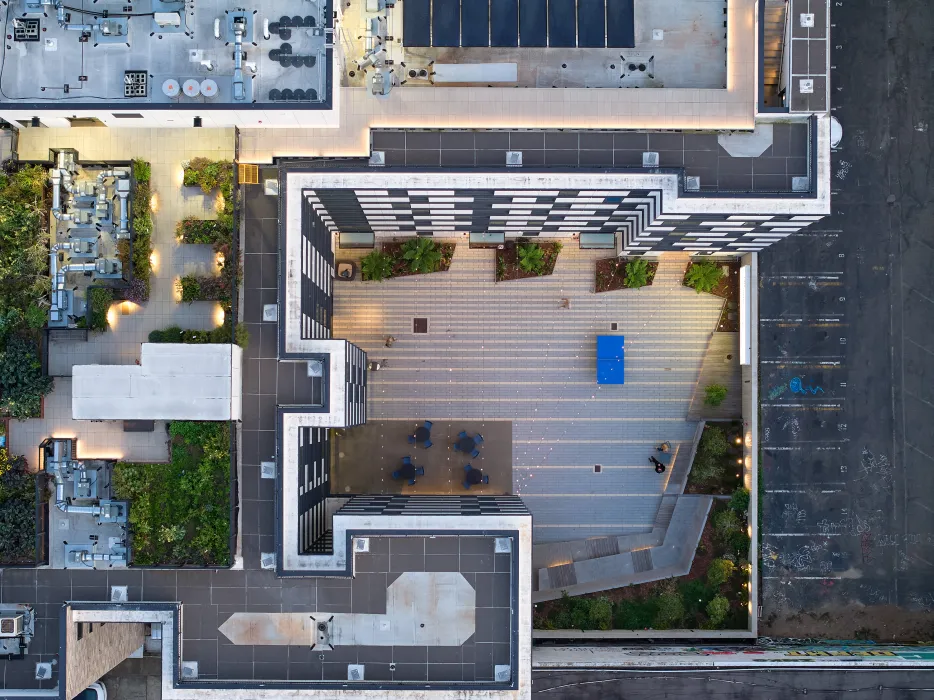 Aerial view of the courtyard and rooftop garden at 555 Larkin at dusk.