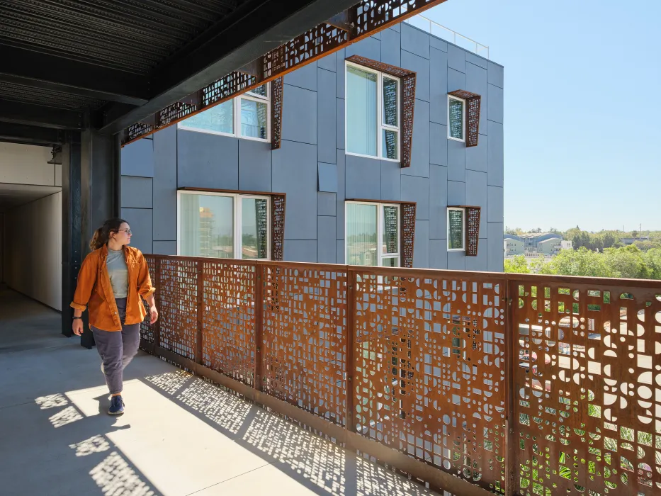 Walking through the open air bridges at Sango Court.