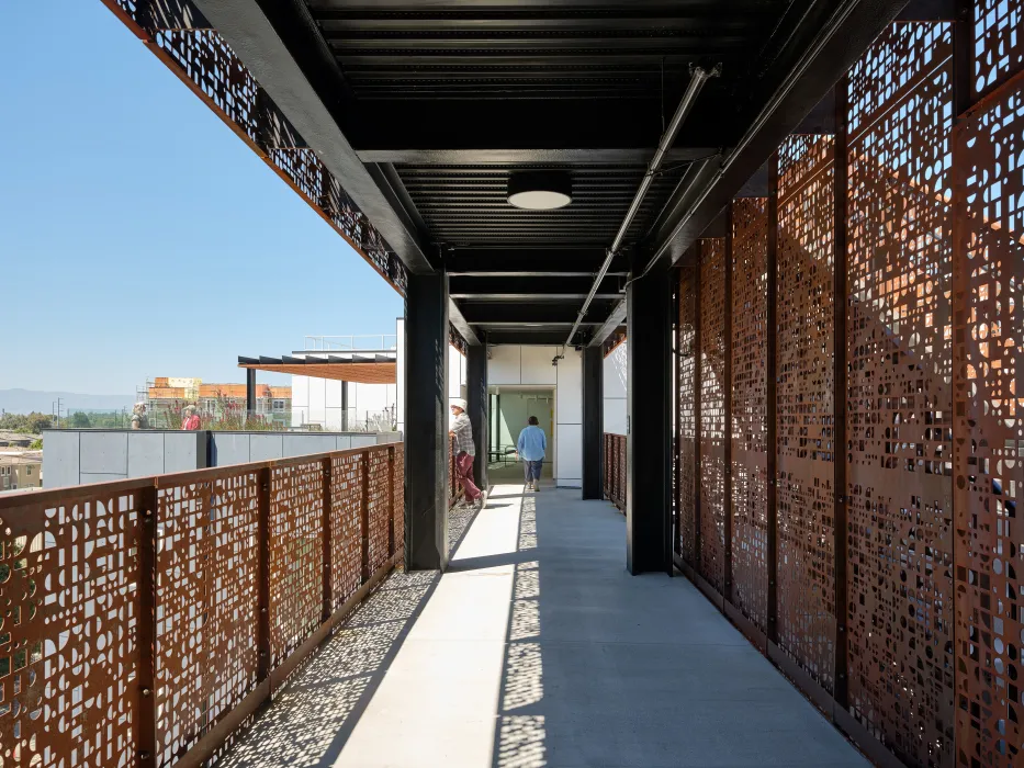 Walking through the open air bridges at Sango Court.