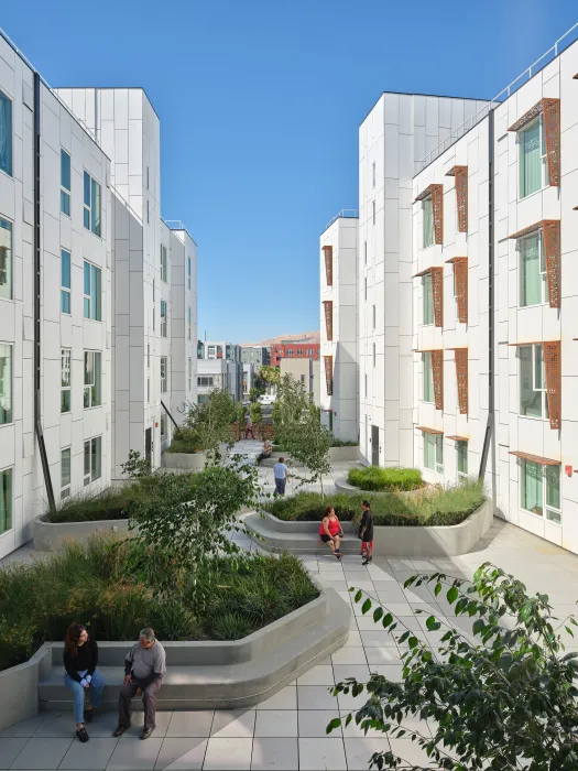 Private courtyard looking from the open-air stair and bridges at Sango Court.