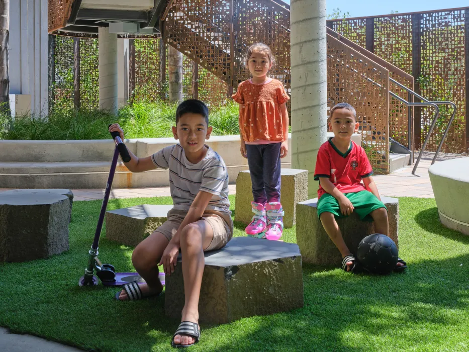 Children playing in the entry courtyard of Sango Court.