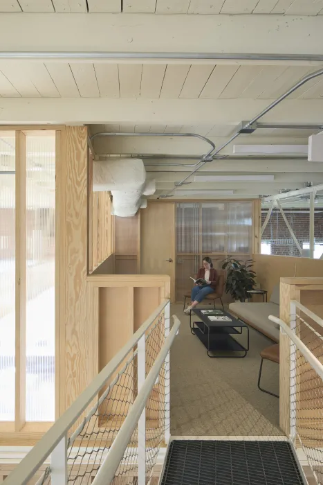 Custom-built catwalk leads to a private loft at Wyatt Builds office.