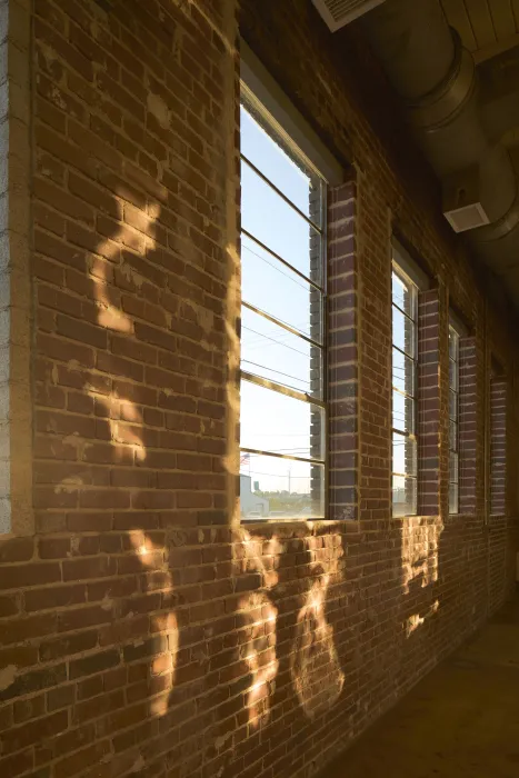 Brick wall inside Wyatt Builds office.